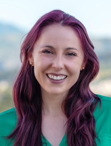 Emma Canepa, MS, CCRP, UCSF smiling in jean jacket with outdoor setting